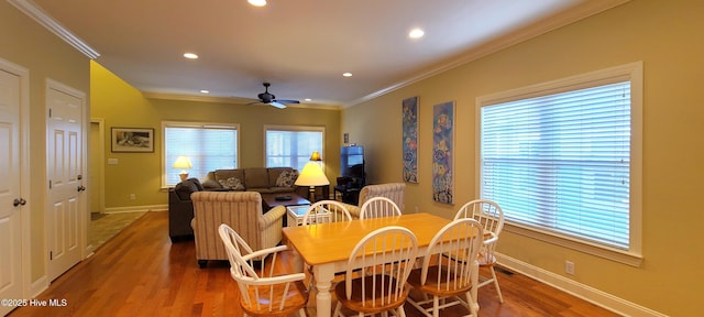 421 30th St, Sunset Beach, NC 28468 - dining space featuring ceiling fan, crown molding, wood finished floors, recessed lighting, and baseboards