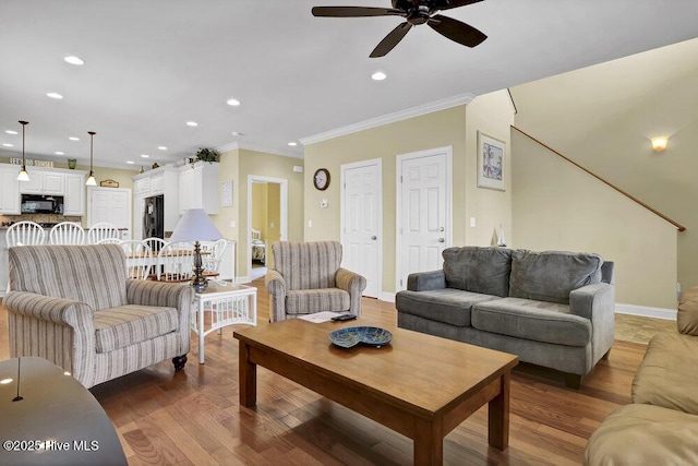 421 30th St, Sunset Beach, NC 28468 - living room featuring ceiling fan, recessed lighting, crown molding, baseboards, and wood finished floors