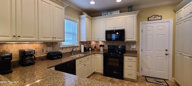 421 30th St, Sunset Beach, NC 28468 - kitchen with black appliances, a sink, crown molding, decorative backsplash, and dark stone counters