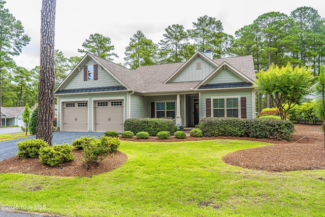 255 Champions Ridge Dr, Southern Pines, NC 28387 - craftsman house featuring a chimney, a front yard, board and batten siding, driveway, and a garage