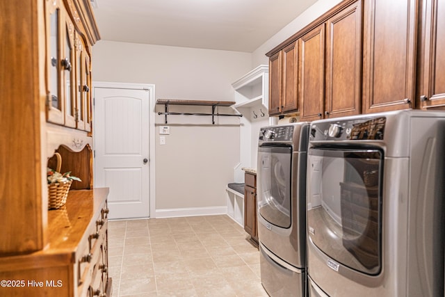 255 Champions Ridge Dr, Southern Pines, NC 28387 - washroom with washing machine and dryer, cabinet space, light tile patterned flooring, and baseboards