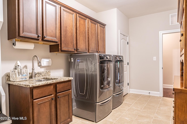 255 Champions Ridge Dr, Southern Pines, NC 28387 - laundry room with washing machine and clothes dryer, cabinet space, and baseboards