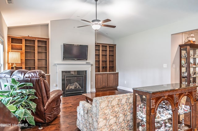 255 Champions Ridge Dr, Southern Pines, NC 28387 - living room with vaulted ceiling, wood finished floors, ceiling fan, and a tile fireplace