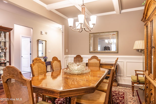 255 Champions Ridge Dr, Southern Pines, NC 28387 - dining room featuring a chandelier, wood finished floors, beamed ceiling, ornamental molding, and wainscoting