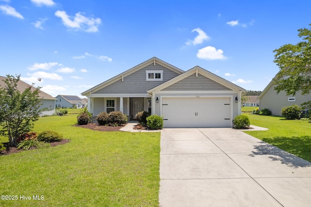 770 Heather Glen Ln, Calabash, NC 28467 - view of front of property featuring a front yard, an attached garage, and concrete driveway