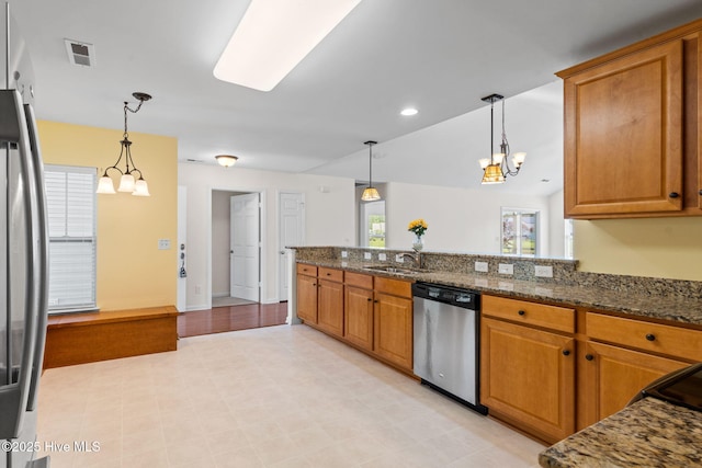 770 Heather Glen Ln, Calabash, NC 28467 - kitchen featuring stainless steel appliances, a chandelier, brown cabinets, and recessed lighting