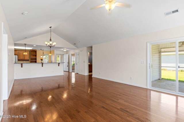770 Heather Glen Ln, Calabash, NC 28467 - unfurnished living room with wood finished floors, ceiling fan, a chandelier, baseboards, and high vaulted ceiling