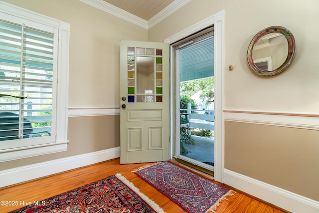 1402 Shepard St, Morehead City, NC 28557 - entryway featuring healthy amount of natural light, wood finished floors, baseboards, and crown molding
