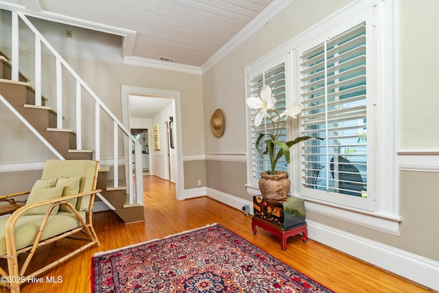 1402 Shepard St, Morehead City, NC 28557 - entrance foyer with healthy amount of natural light, crown molding, stairway, and wood finished floors