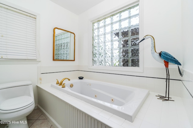 1402 Shepard St, Morehead City, NC 28557 - bathroom with a jetted tub, plenty of natural light, toilet, and tile patterned flooring