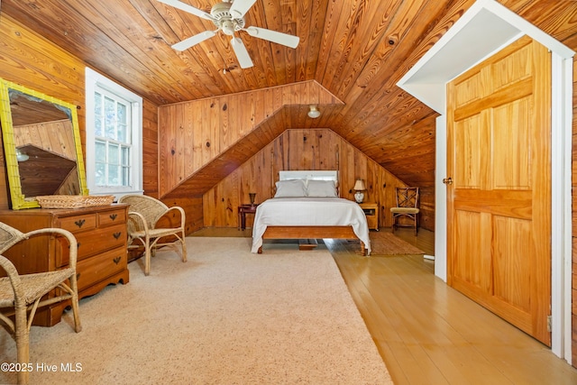 1402 Shepard St, Morehead City, NC 28557 - bedroom with wooden walls, wood ceiling, lofted ceiling, wood-type flooring, and a ceiling fan