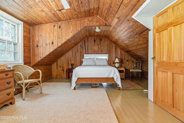 1402 Shepard St, Morehead City, NC 28557 - bedroom with wood walls, vaulted ceiling, hardwood / wood-style flooring, and wooden ceiling
