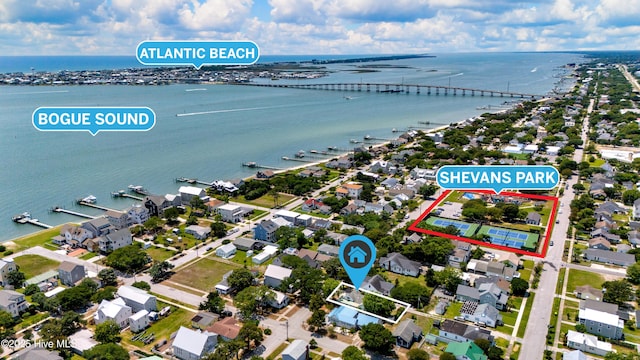 1402 Shepard St, Morehead City, NC 28557 - aerial view of residential area with a large body of water, property parcel outlined, and a notable bridge