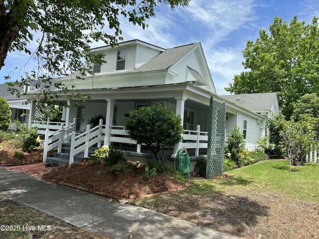 1402 Shepard St, Morehead City, NC 28557 - view of front of house featuring a porch and roof with shingles