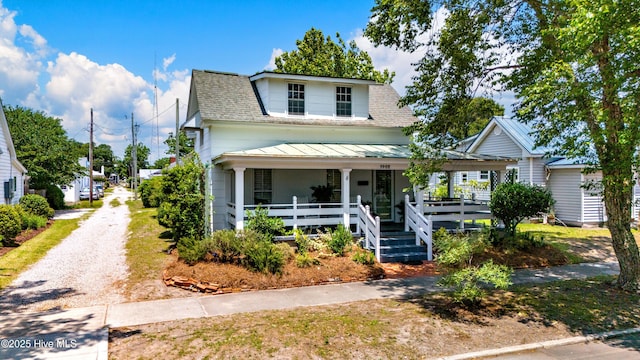 1402 Shepard St, Morehead City, NC 28557 - view of front facade featuring covered porch, a shingled roof, and a standing seam roof