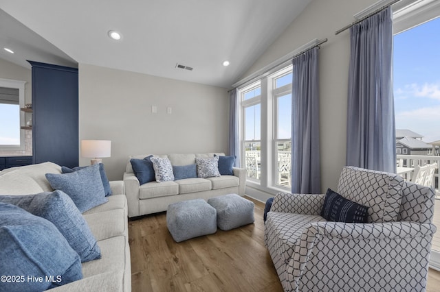 145 Oceanview Ln, North Topsail Beach, NC 28460 - living area featuring vaulted ceiling, wood finished floors, and recessed lighting