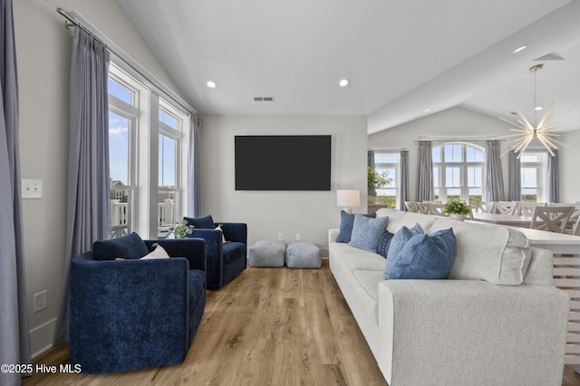 145 Oceanview Ln, North Topsail Beach, NC 28460 - living area with vaulted ceiling, light wood-style floors, and recessed lighting