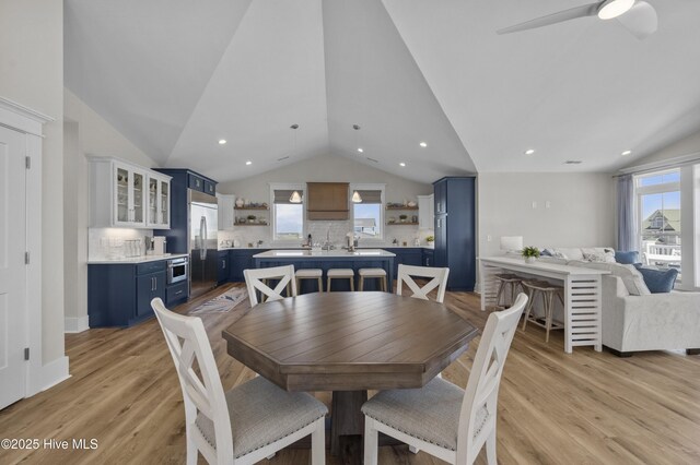 145 Oceanview Ln, North Topsail Beach, NC 28460 - dining room featuring lofted ceiling, light wood-style floors, a ceiling fan, and recessed lighting