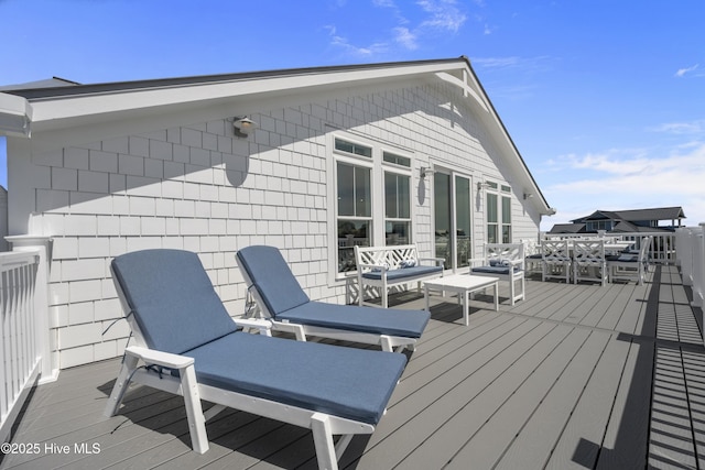 145 Oceanview Ln, North Topsail Beach, NC 28460 - wooden deck with an outdoor hangout area