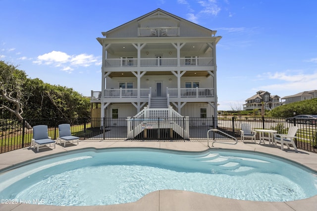 145 Oceanview Ln, North Topsail Beach, NC 28460 - view of swimming pool with stairway and a patio