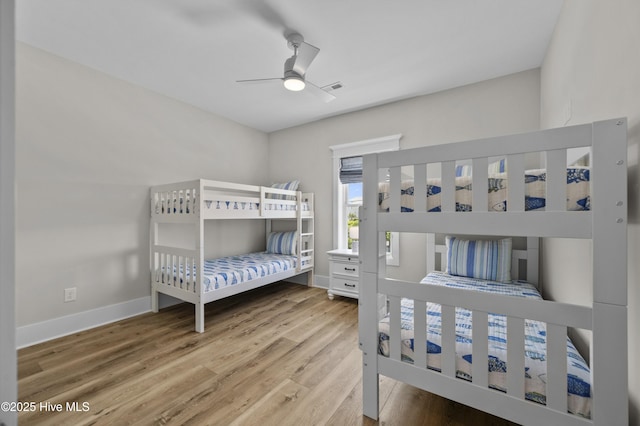 145 Oceanview Ln, North Topsail Beach, NC 28460 - bedroom with wood finished floors, baseboards, and a ceiling fan