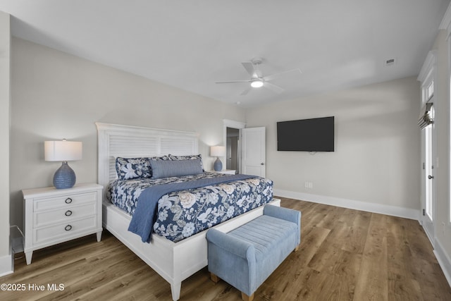 145 Oceanview Ln, North Topsail Beach, NC 28460 - bedroom featuring wood finished floors, baseboards, and a ceiling fan