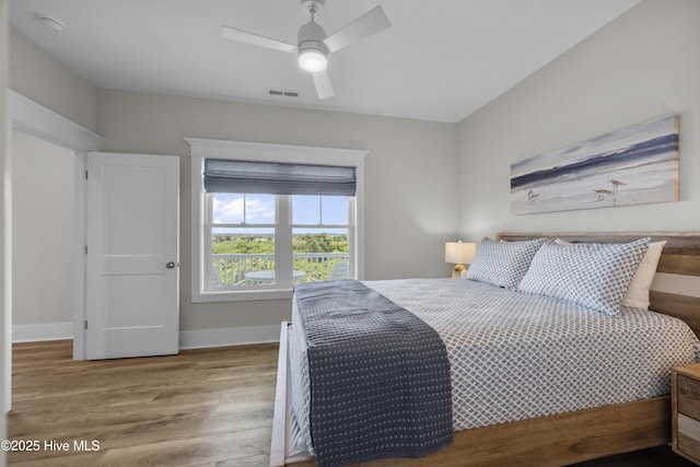 145 Oceanview Ln, North Topsail Beach, NC 28460 - bedroom featuring wood finished floors, baseboards, and a ceiling fan