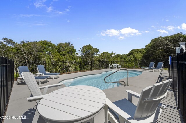 145 Oceanview Ln, North Topsail Beach, NC 28460 - view of pool featuring a patio area and view of wooded area