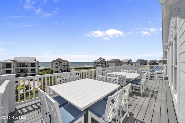145 Oceanview Ln, North Topsail Beach, NC 28460 - wooden deck with outdoor dining space and a water view