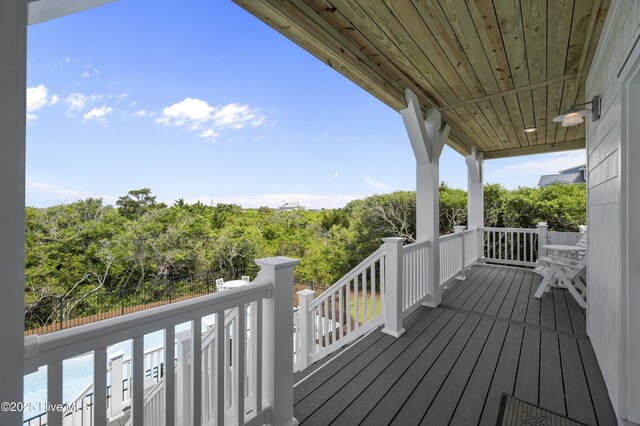 145 Oceanview Ln, North Topsail Beach, NC 28460 - wooden deck featuring a wooded view