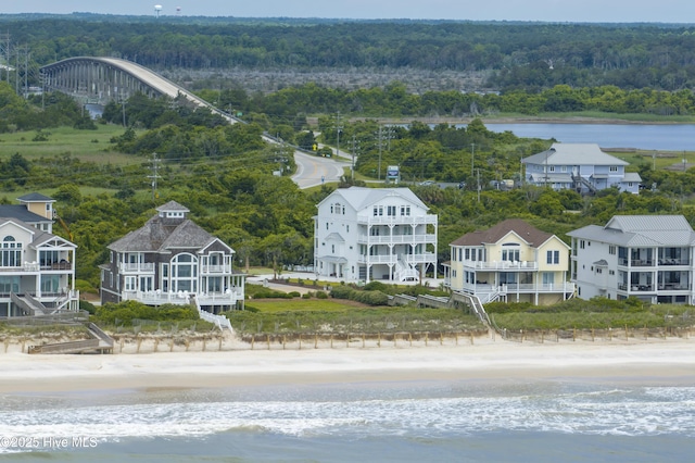 145 Oceanview Ln, North Topsail Beach, NC 28460 - bird's eye view of waterfront with a beach and a heavily wooded area