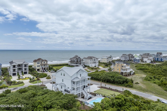 145 Oceanview Ln, North Topsail Beach, NC 28460 - drone / aerial view of a large body of water and a pool area