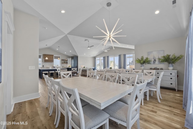 145 Oceanview Ln, North Topsail Beach, NC 28460 - dining area with lofted ceiling, light wood finished floors, a ceiling fan, recessed lighting, and baseboards