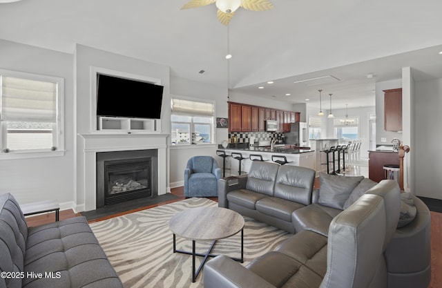 1102 Canal Dr Unit 1 & 2, Carolina Beach, NC 28428 - living area featuring recessed lighting, ceiling fan, wood finished floors, a fireplace with flush hearth, and baseboards