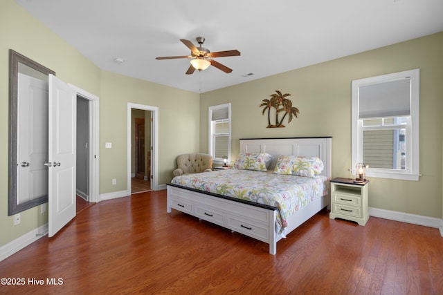 1102 Canal Dr Unit 1 & 2, Carolina Beach, NC 28428 - bedroom featuring dark wood-type flooring and a ceiling fan