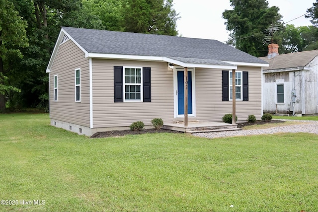 102 Nash St, Elm City, NC 27822 - view of front of house featuring a front yard and roof with shingles