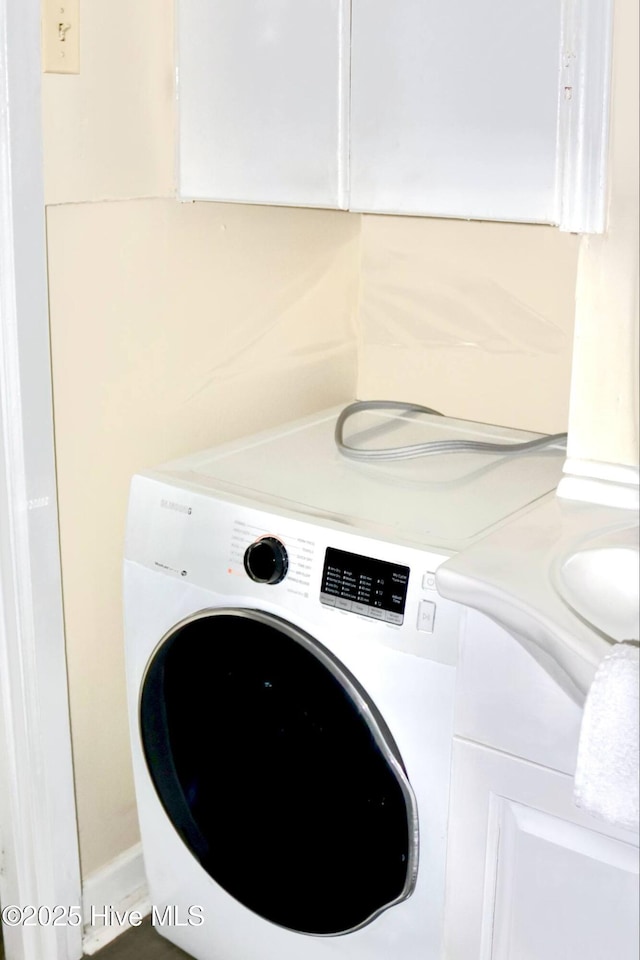 102 Nash St, Elm City, NC 27822 - laundry room featuring washer / clothes dryer and cabinet space