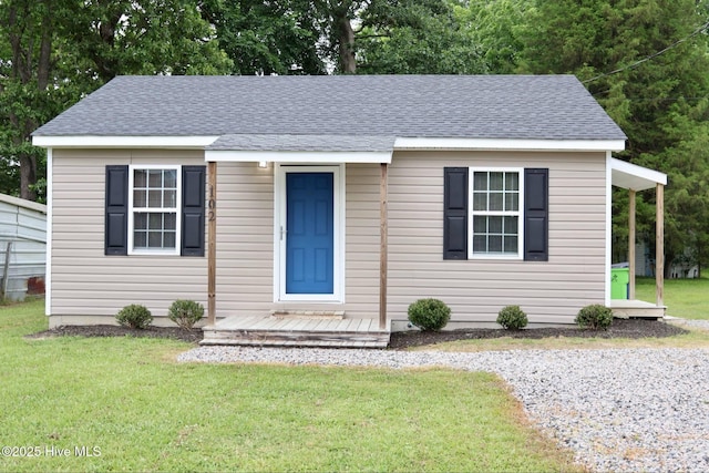 102 Nash St, Elm City, NC 27822 - bungalow with a front yard and a shingled roof