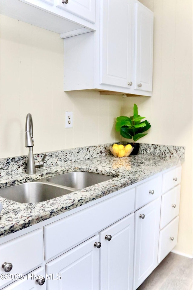 102 Nash St, Elm City, NC 27822 - kitchen with white cabinetry and light stone countertops