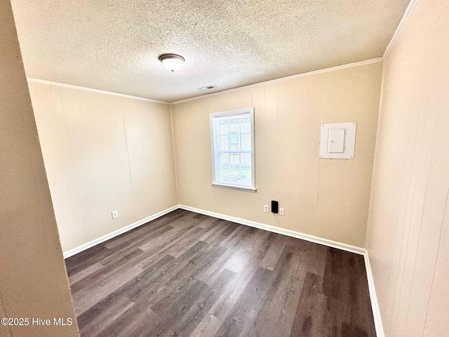 102 Nash St, Elm City, NC 27822 - empty room with dark wood-style flooring, crown molding, a textured ceiling, and electric panel