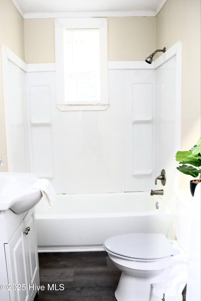 102 Nash St, Elm City, NC 27822 - full bathroom with vanity, tub / shower combination, wood finished floors, and crown molding