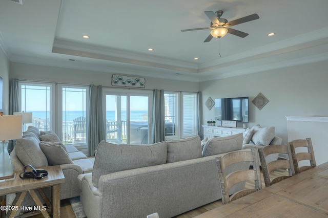 876-878 Villas Dr, North Topsail Beach, NC 28460 - living area with a tray ceiling, ceiling fan, ornamental molding, recessed lighting, and wood finished floors