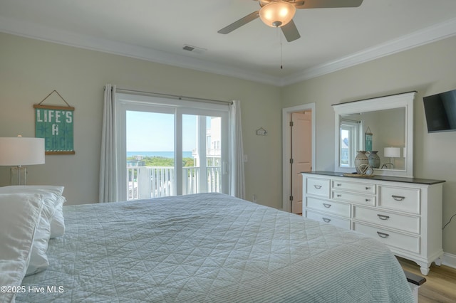 876-878 Villas Dr, North Topsail Beach, NC 28460 - bedroom featuring access to exterior, crown molding, multiple windows, wood finished floors, and a ceiling fan