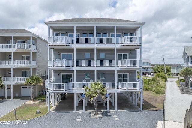 876-878 Villas Dr, North Topsail Beach, NC 28460 - view of property with a carport and gravel driveway