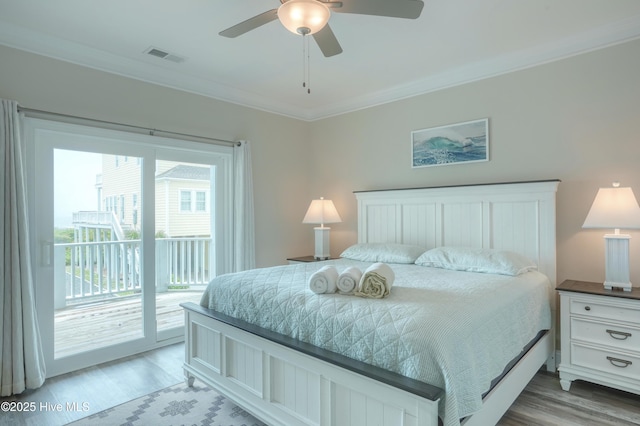 876-878 Villas Dr, North Topsail Beach, NC 28460 - bedroom with access to outside, crown molding, light wood-type flooring, and a ceiling fan
