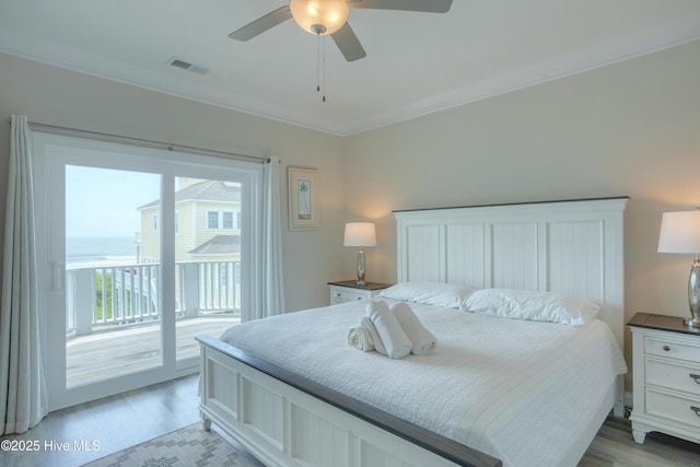 876-878 Villas Dr, North Topsail Beach, NC 28460 - bedroom with access to exterior, light wood-type flooring, ornamental molding, and ceiling fan