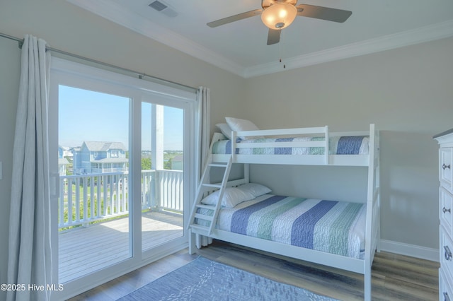 876-878 Villas Dr, North Topsail Beach, NC 28460 - bedroom with ornamental molding, wood finished floors, access to exterior, and ceiling fan