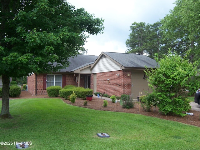 100 Pinehurst Trace Dr, Pinehurst, NC 28374 - ranch-style home with brick siding, a front yard, and roof with shingles