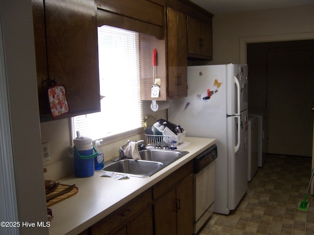 100 Pinehurst Trace Dr, Pinehurst, NC 28374 - kitchen with white dishwasher, a sink, and light countertops