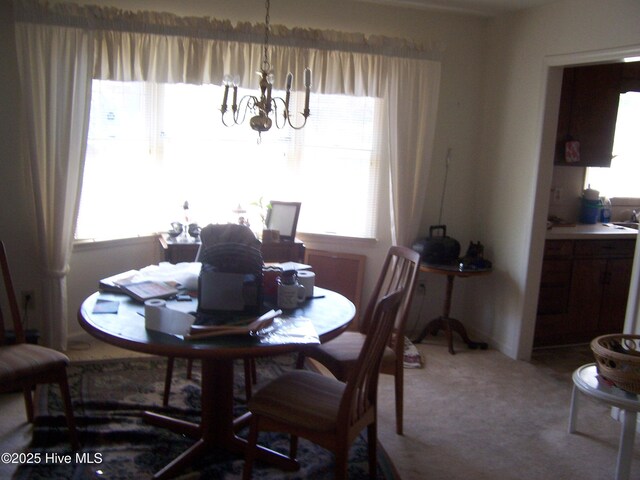 100 Pinehurst Trace Dr, Pinehurst, NC 28374 - dining space featuring a chandelier, plenty of natural light, and carpet floors